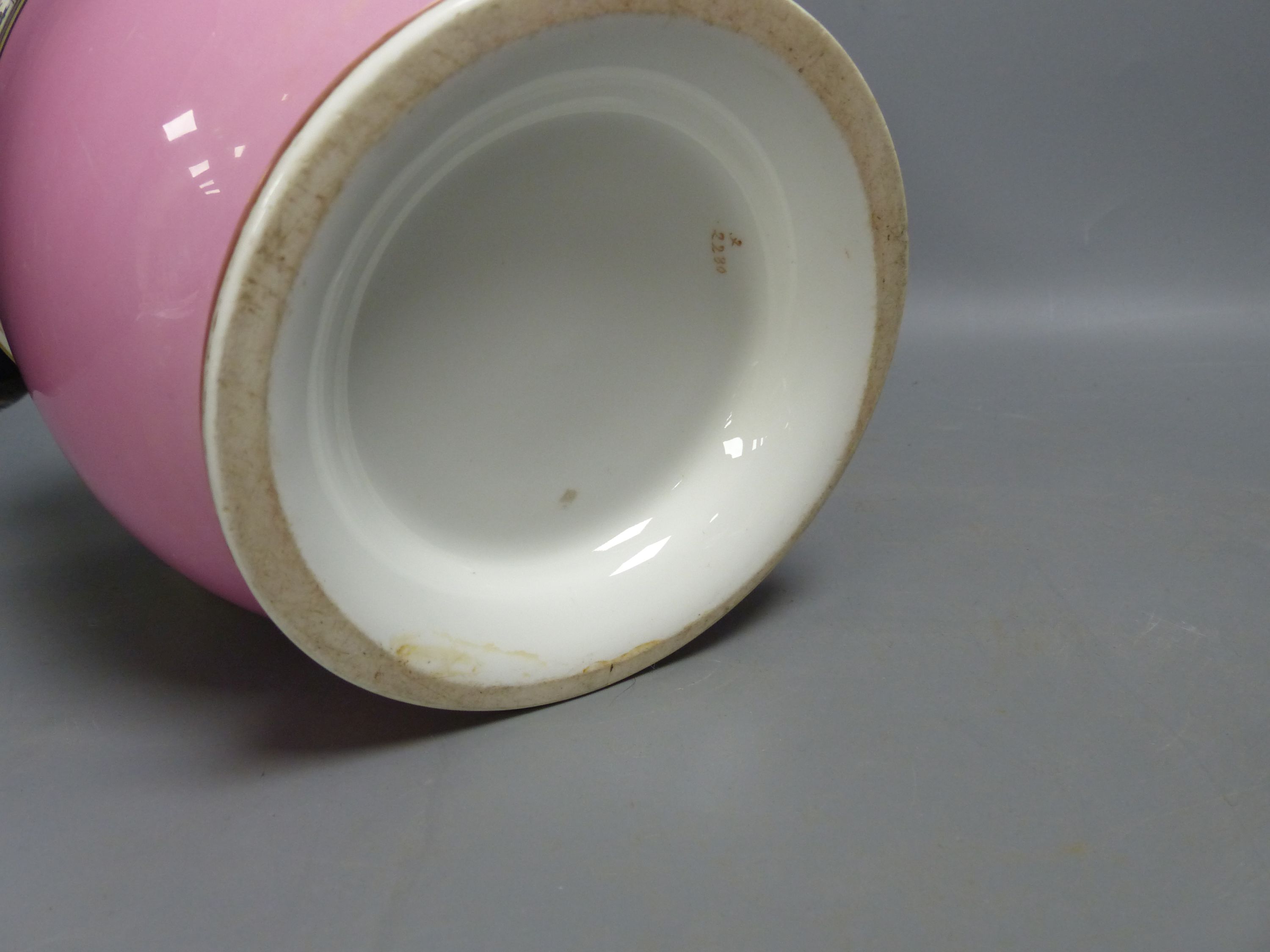 A Paris porcelain pink ground cache pot and a similar dressing table set, largest 27cm